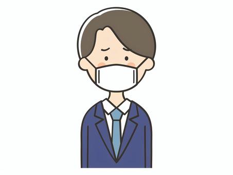 困った表情のマスクをしたスーツの男性