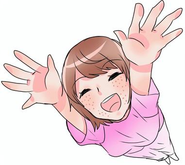 喜びバンザイする女性