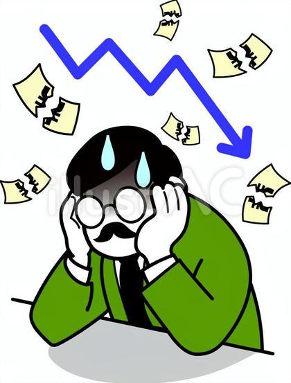業績悪化で株が暴落し呆然とする男性会社員