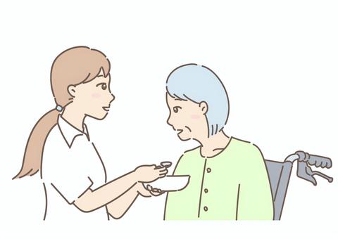 食事を介助する介護士と車いすの高齢者２ 介護,介護士,福祉,介助,ナース,看護師,介護福祉士,高齢者,老人ホーム,ナーシングホームのイラスト素材