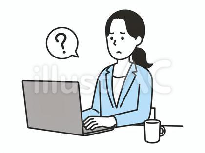 パソコンを見て悩むスーツを着た女性