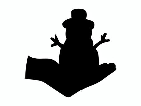 手の平に乗せた雪だるまのシルエット