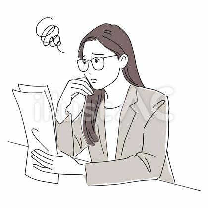 書類を見て困っているビジネスウーマン