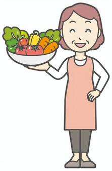  ヘルシーな野菜を持っているおばさん 野菜,女性,人,主婦,中年,シニア,エプロン,ママ,お母さん,おかんのイラスト素材