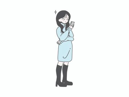スマホを見る女性 全身 冬（満足げ） 女性,スマホ,冬服,全身,立ち姿,sns,メッセージ,説明,レビュー,シンプルのイラスト素材