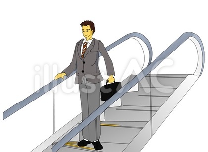 エスカレーターに乗る男性会社員