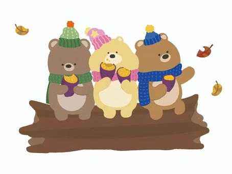 焼き芋を食べるクマたち 動物,冬,くま,焼き芋,マフラー,ニット帽,仲良し,兄弟,三つ子,落ち葉のイラスト素材