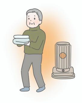暖かい部屋で着替えの用意をする高齢男性 ヒートショック,高齢者,男性,冬,血圧安定,暖房,ストーブ,着替え,準備,部屋のイラスト素材