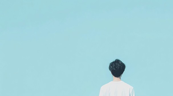 白いシャツの男性の背中