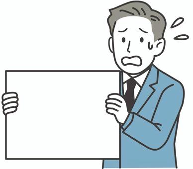 ボードでメッセージを伝える焦り顔の男性 人物,男性,ボード,伝言,メッセージ,緊急,お知らせ,看板,商用利用可,受付のイラスト素材