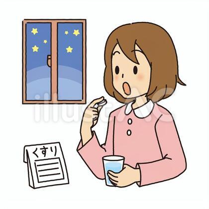 寝る前に薬を飲む女の子