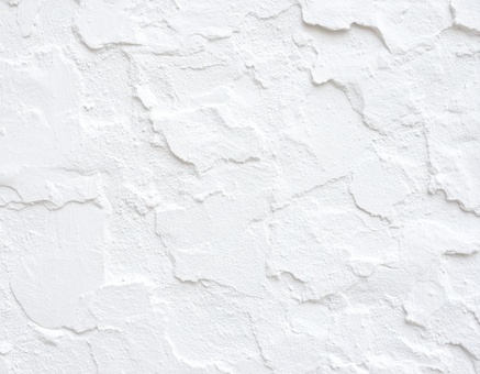 手作業で塗られた白い壁の凹凸テクスチャ