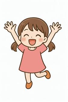 バンザイして喜ぶかわいい女の子