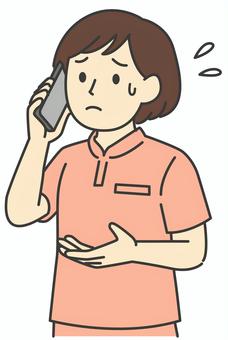 スマホで困った顔で電話する女性介護士 人物,女性,福祉,電話,スマホ,介護,介助,ヘルパー,介護士,困るのイラスト素材