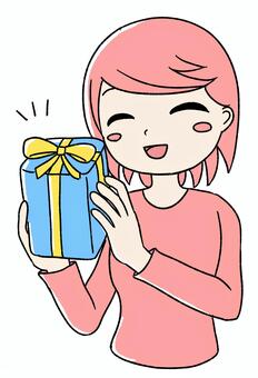 桃色の女の子がプレゼントで喜ぶ ピンク,かわいい,手描き,プレゼント,ギフト,贈り物,喜ぶ,ハッピー,サプライズ,プレゼントボックスのイラスト素材