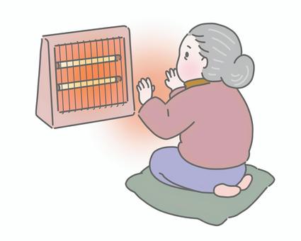 電気ストーブで暖まるおばあさん  電気ストーブ,冬,高齢者,シニア,暖房,暖かい,寒い日,暮らし,座布団,おうち時間のイラスト素材