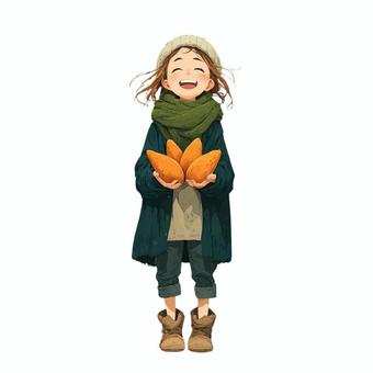 笑顔でサツマイモを持つ女の子