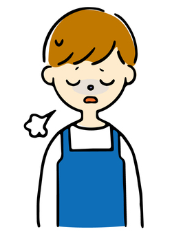 疲れ気味のエプロン男性