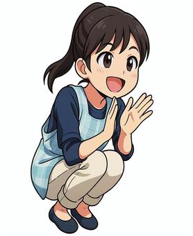 しゃがんで応援してる女性