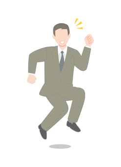 うきうきジャンプするスーツの男性