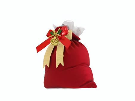 冬のクリスマスプレゼントを入れたサンタ袋 冬のクリスマスプレゼントを入れたサンタ袋 クリスマス,プレゼント,ギフト,袋,ラッピング,ベル,リボンのイラスト素材