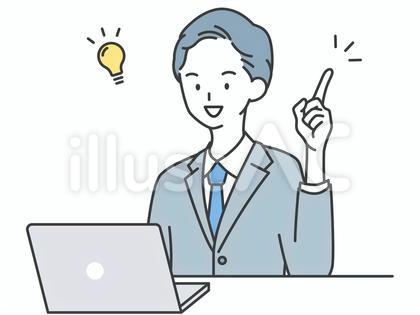 パソコンの前で良いことをひらめく男性