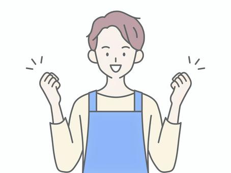 両手でガッツポーズするエプロンの男性 人物,男,エプロン,主夫,保育士,ヘルパー,介護士,頑張る,気合い,根性のイラスト素材