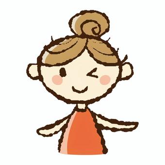 笑顔でウィンクをする団子ヘアの若い女性