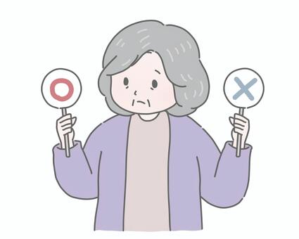 マルバツ札を持って悩んでいる高齢女性  シニア,高齢者,おばあさん,女性,マル,バツ,正解,不正解,クイズ,札のイラスト素材