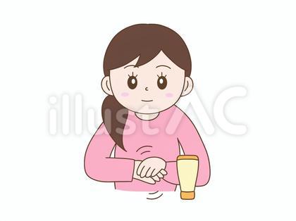 ハンドクリームを塗るかわいい女性