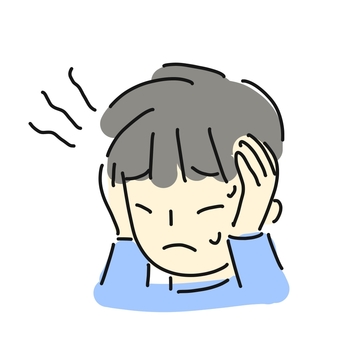 悩んでいる様子の少年