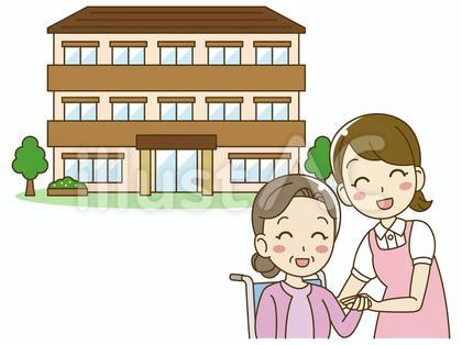 老人ホームで手を取り合う介護士と高齢者