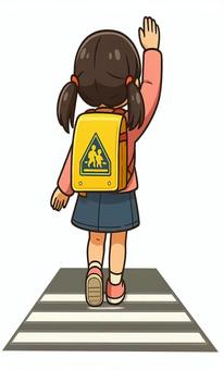 右手を上げて横断歩道を渡る女の子 後ろ姿