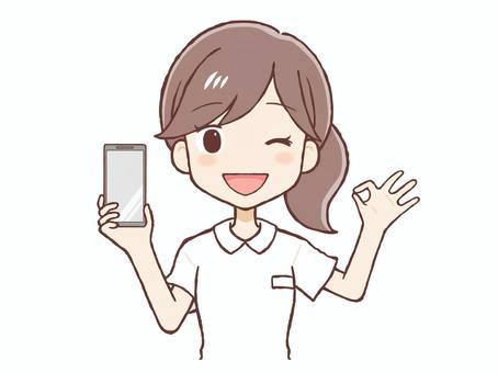 携帯を持ちOKサインをだす看護師（上半身 看護師,女,白衣,ok,サイン,ハンド,看護婦,ナース,薬剤師,携帯のイラスト素材