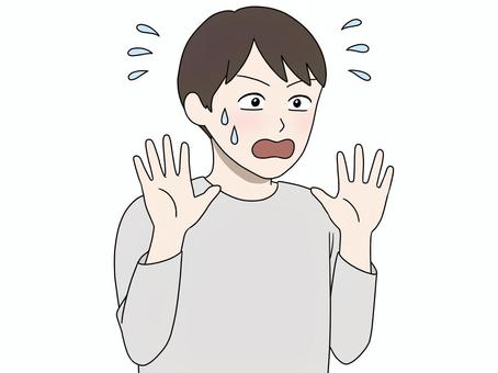 手を振って拒否する男性