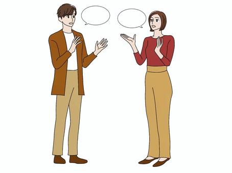 手振りを交えて会話・議論をする女性と男性