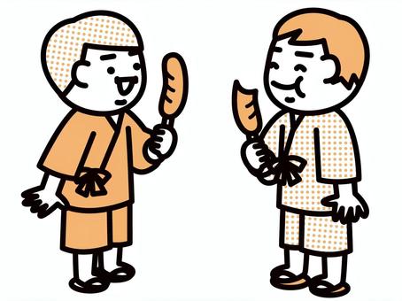 フランクフルトを食べる男の子