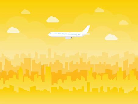 飛行機と街並みと黄色い空 飛行機,乗り物,街並み,空,雲,風景,イラスト,素材のイラスト素材