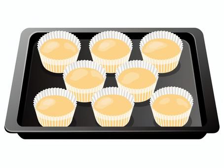 カップケーキ型に流したケーキ生地 ケーキ生地,カップケーキ型,カップケーキ,お菓子作り,料理,食べ物,天板のイラスト素材