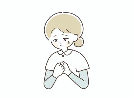 不安そうな表情の看護師