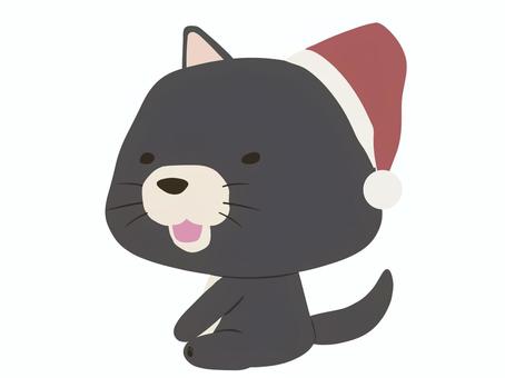 サンタ帽をかぶった笑顔の黒い犬