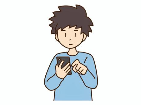 スマートフォンを操作する男性