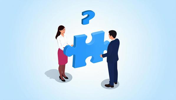 ジグソーパズルを持つビジネスパーソン