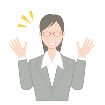 喜ぶスーツ姿の若いメガネの女性