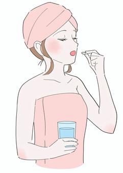 サプリを飲む女性のイラスト