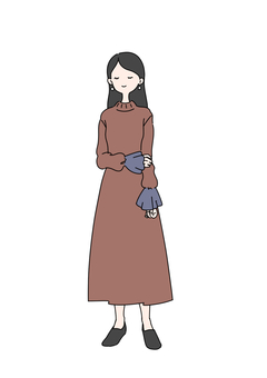 長袖ワンピースを着て立っている女性