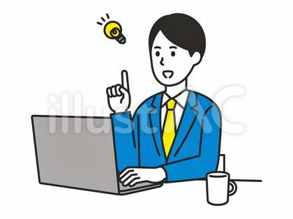パソコンの前で指差しするスーツを着た男性