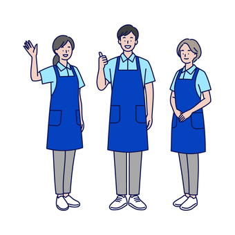 笑顔で挨拶するエプロンスタッフ男女三人