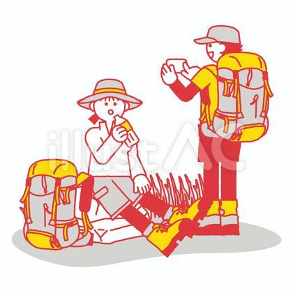 登山中に休憩する男女