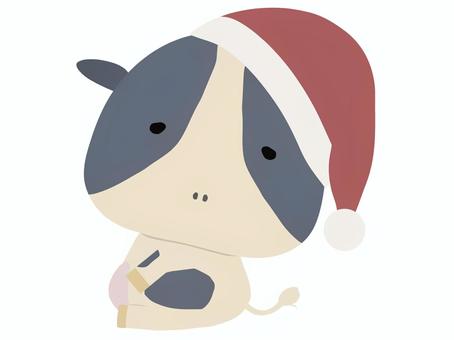 サンタ帽をかぶった牛